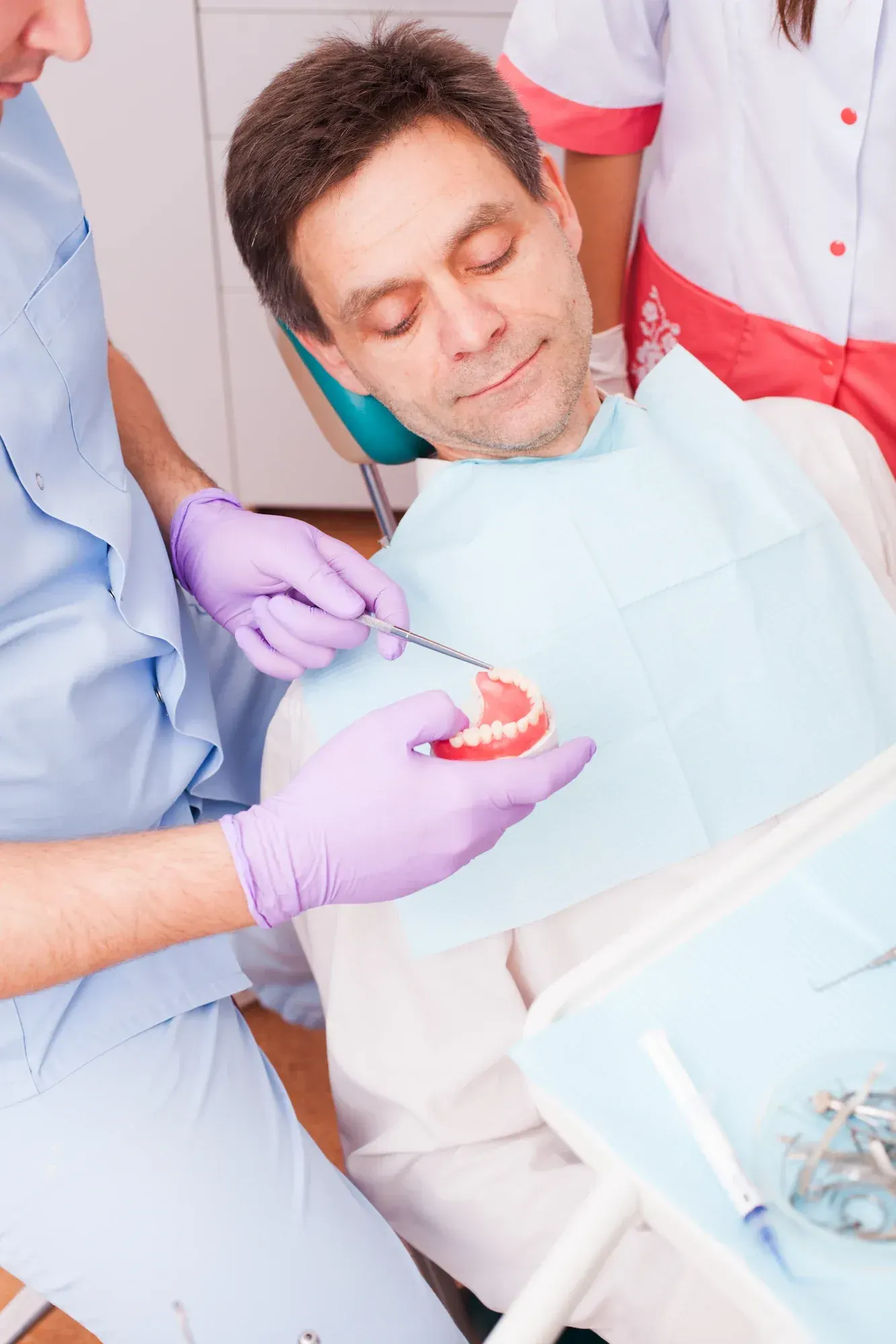 Close up illustration of an All-on-X full-arch implant bridge with multiple implants