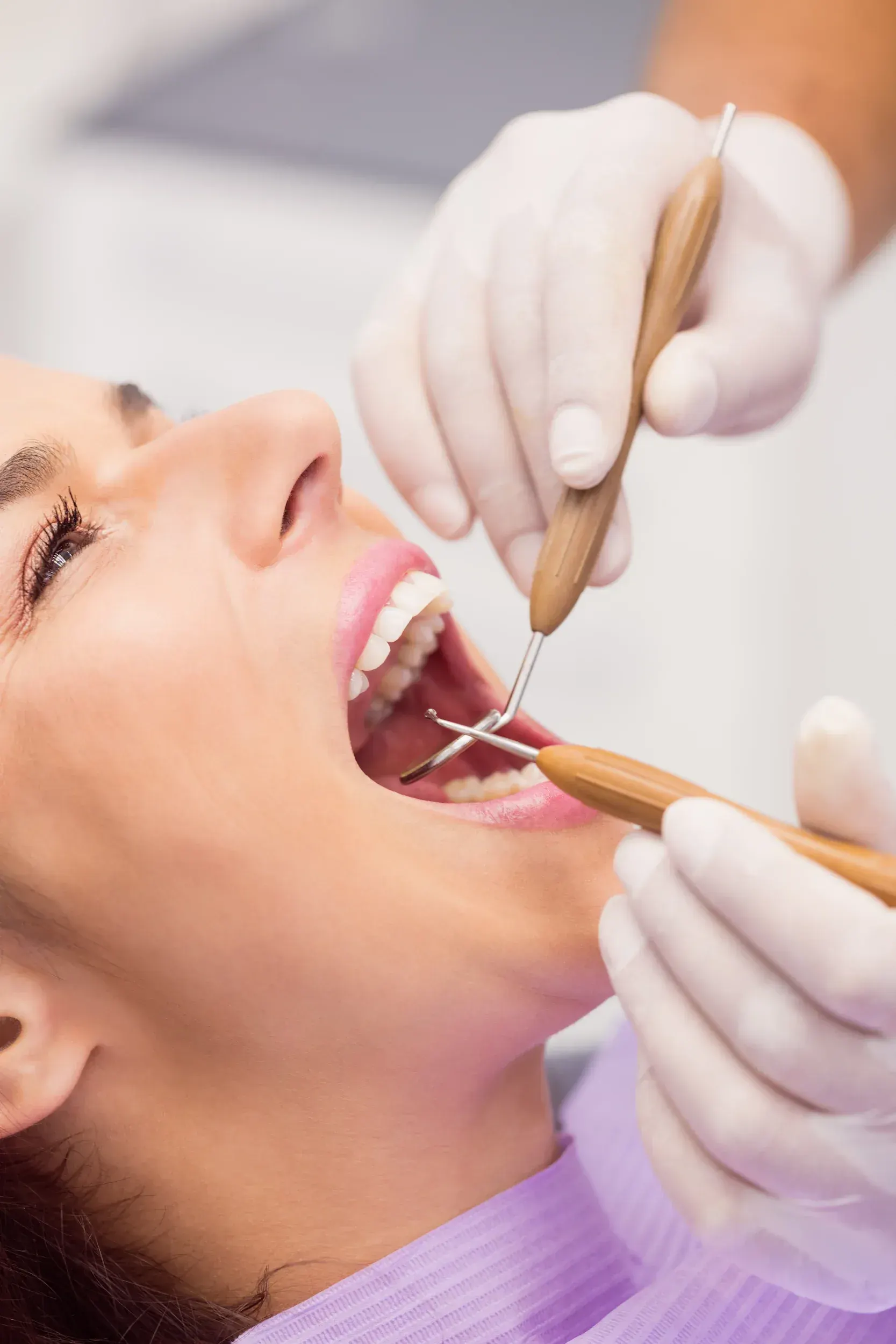 Patient consultation with Dr. Cook reviewing a crown treatment plan