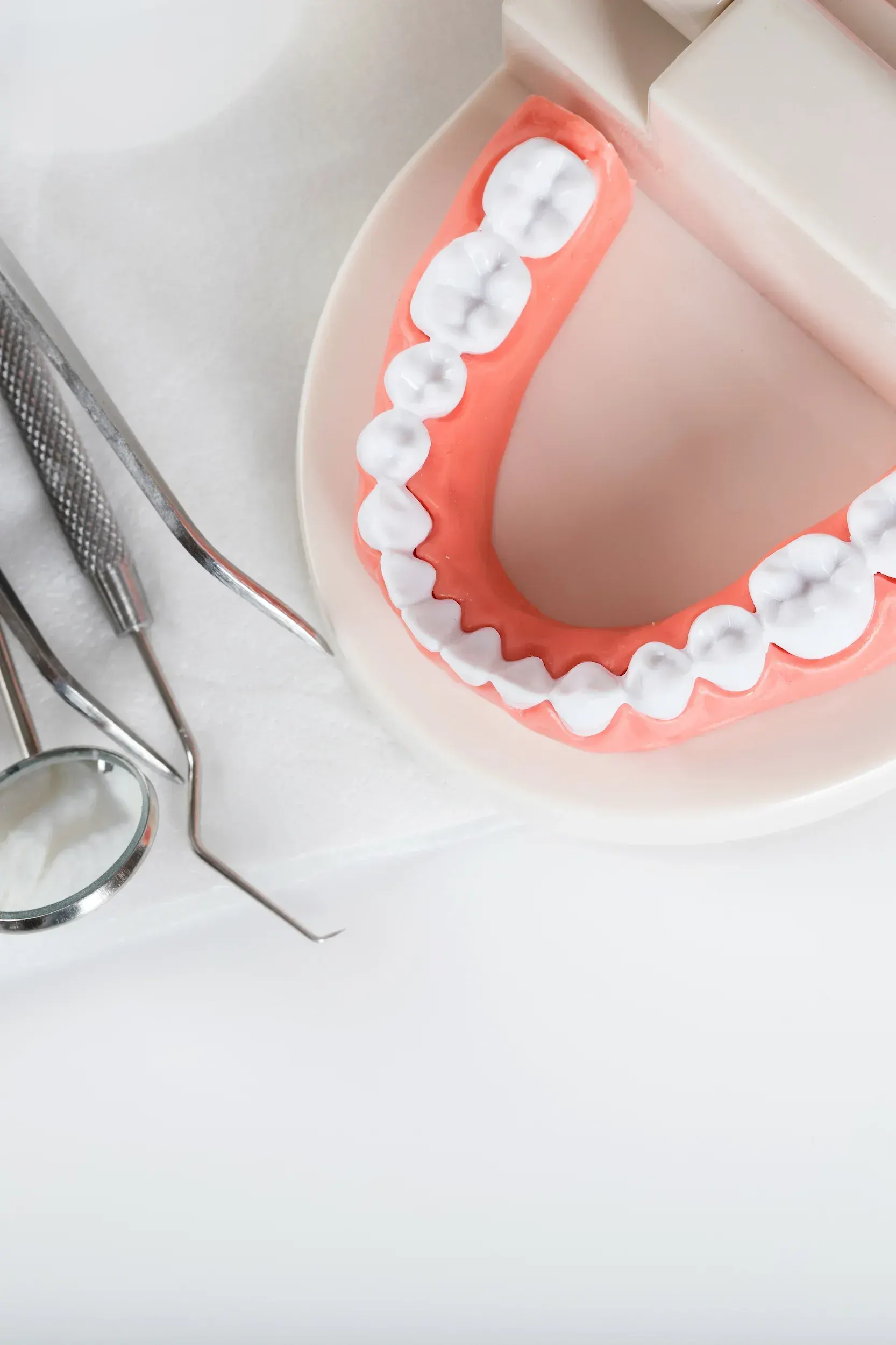 Side-by-side view of a patient before and after receiving dentures