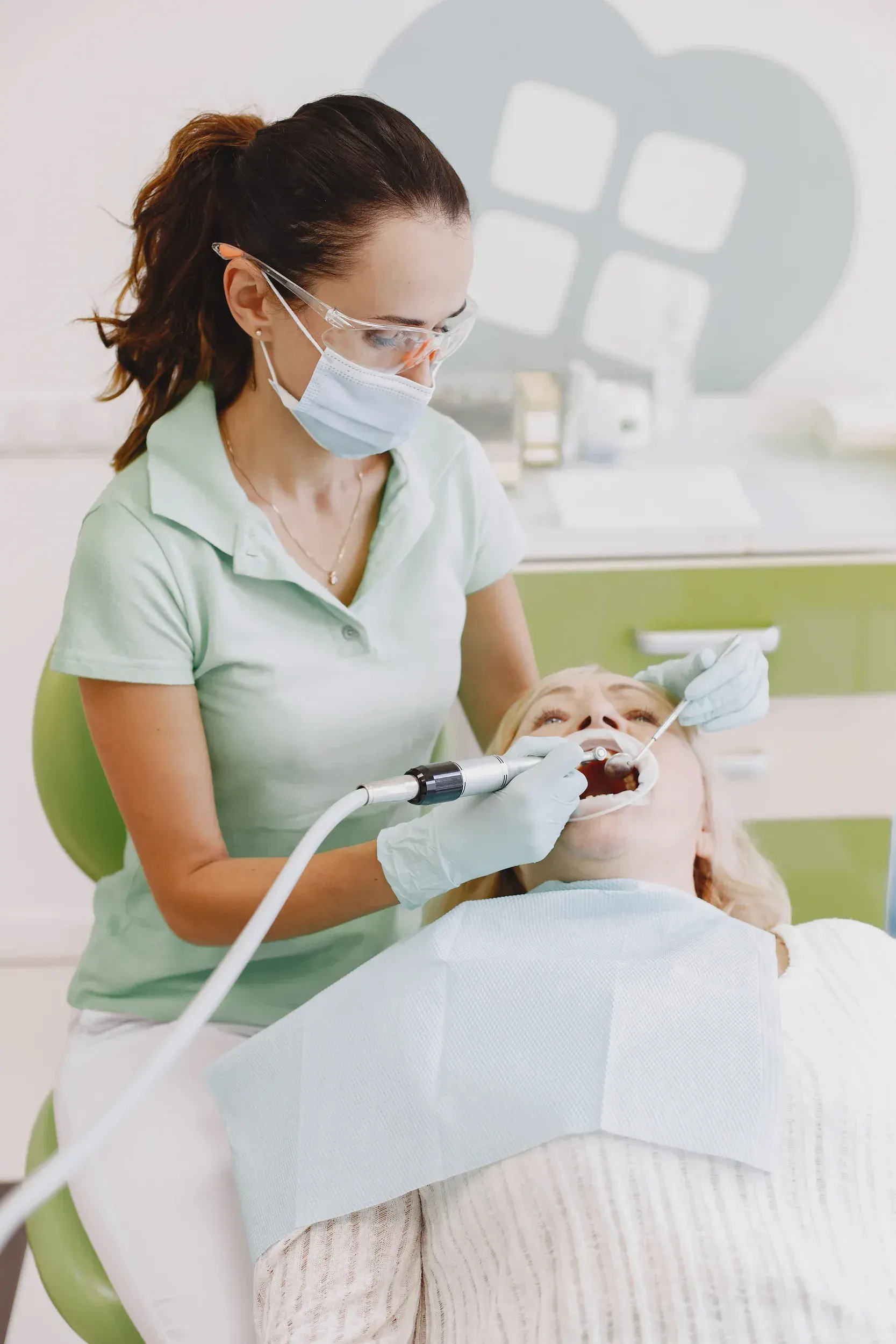 Patient consultation with Dr. Cook reviewing a denture treatment plan