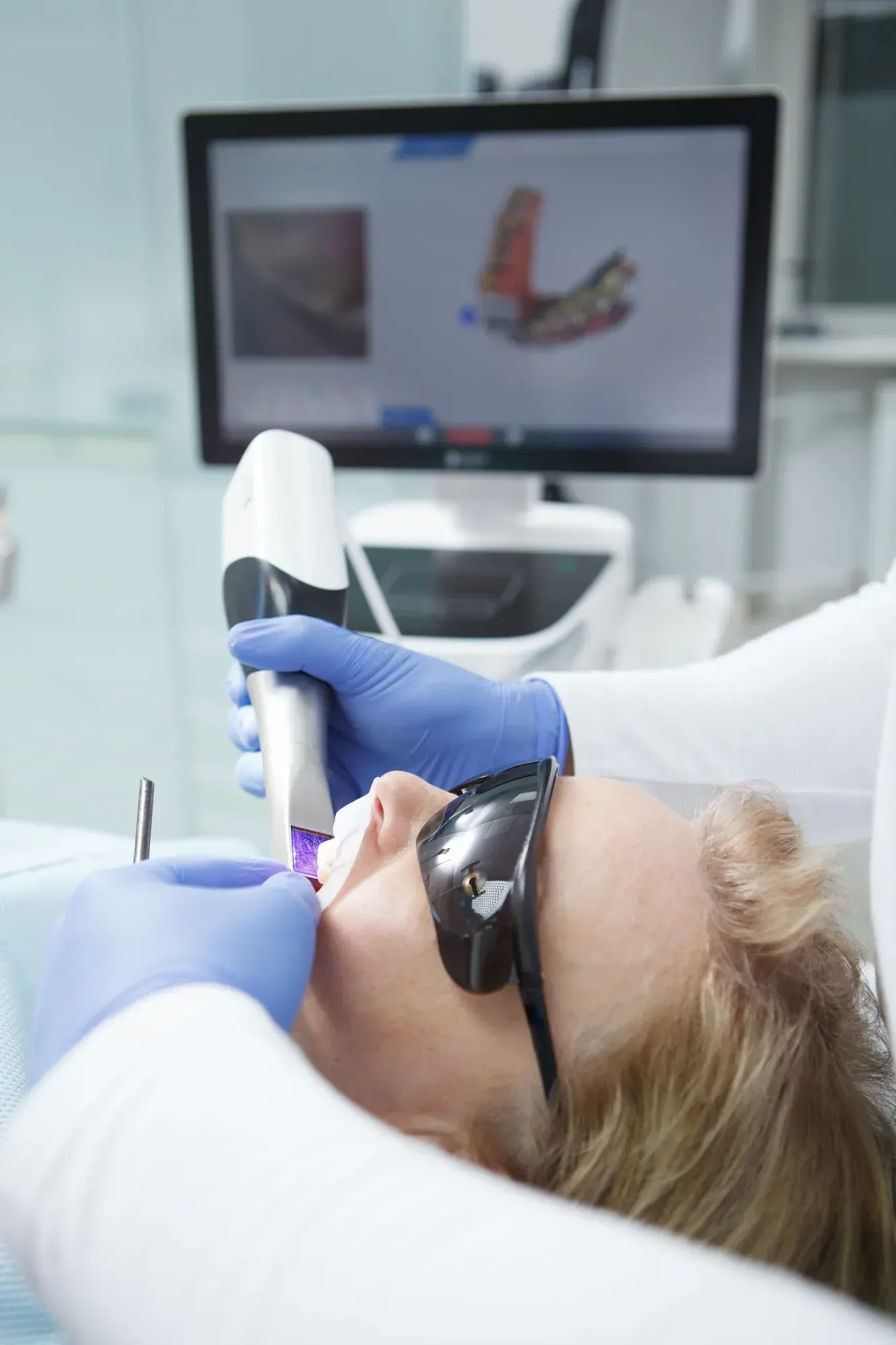 Portrait of a confident adult patient seated in the dental chair at Cook Family Dentistry
